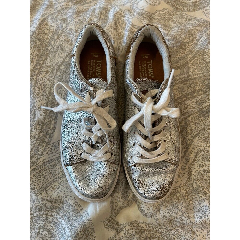 Women’s size 6 silver and brown foil Tom’s sneakers